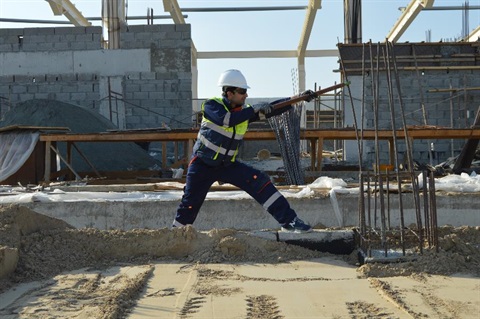 A builder working on a construction site.