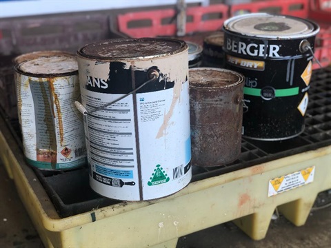 Some old paint tins at the recycling centre.