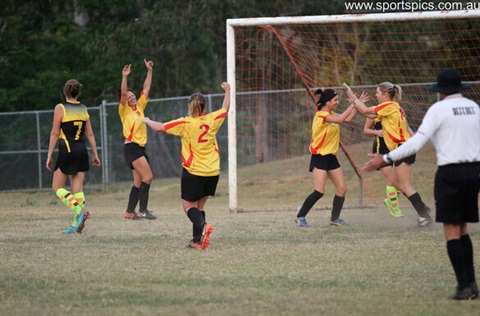 A team of women playing soccer.