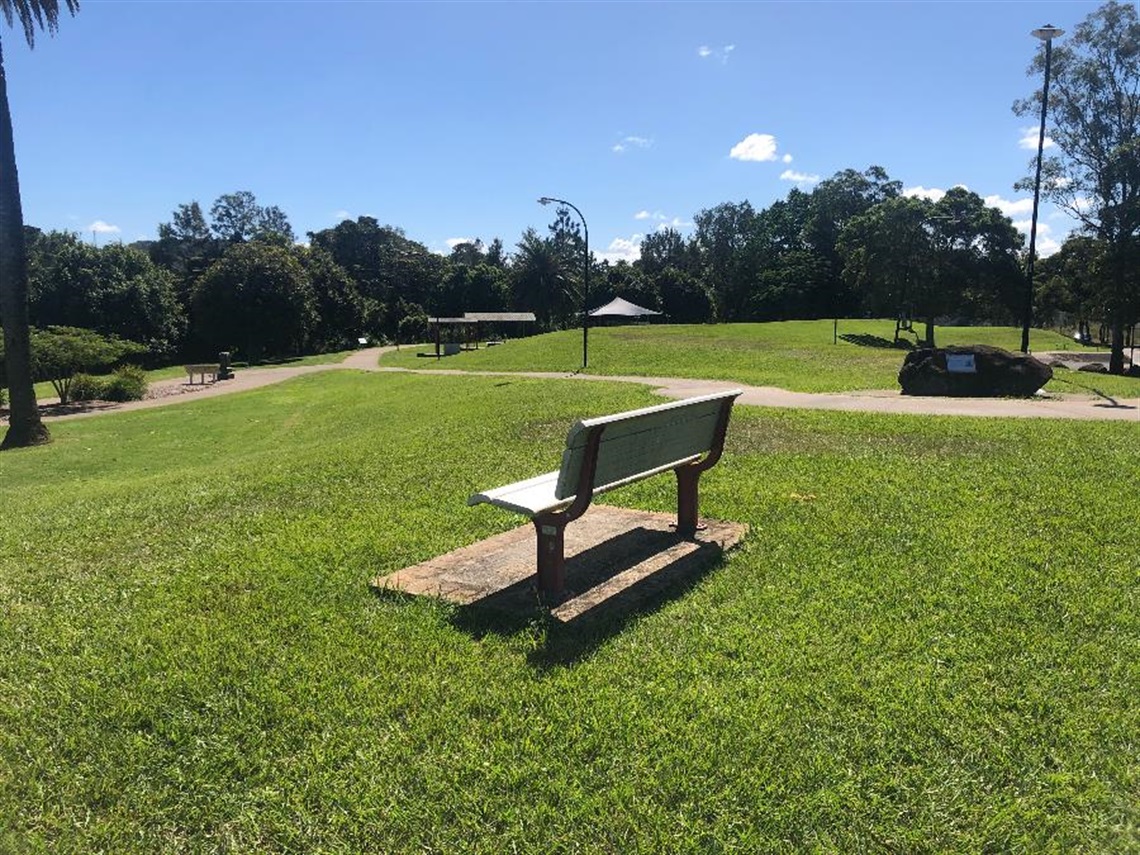 A bench overlooking the Wilsons River at Riverside Park.