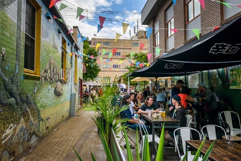 People dining outdoors during a previous Eat the Street event.