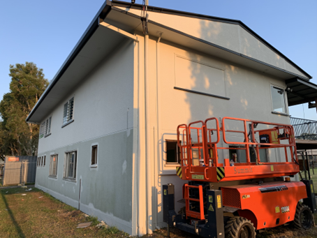 Painting the exterior of the building.