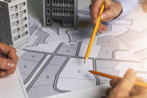 People looking over development plans.