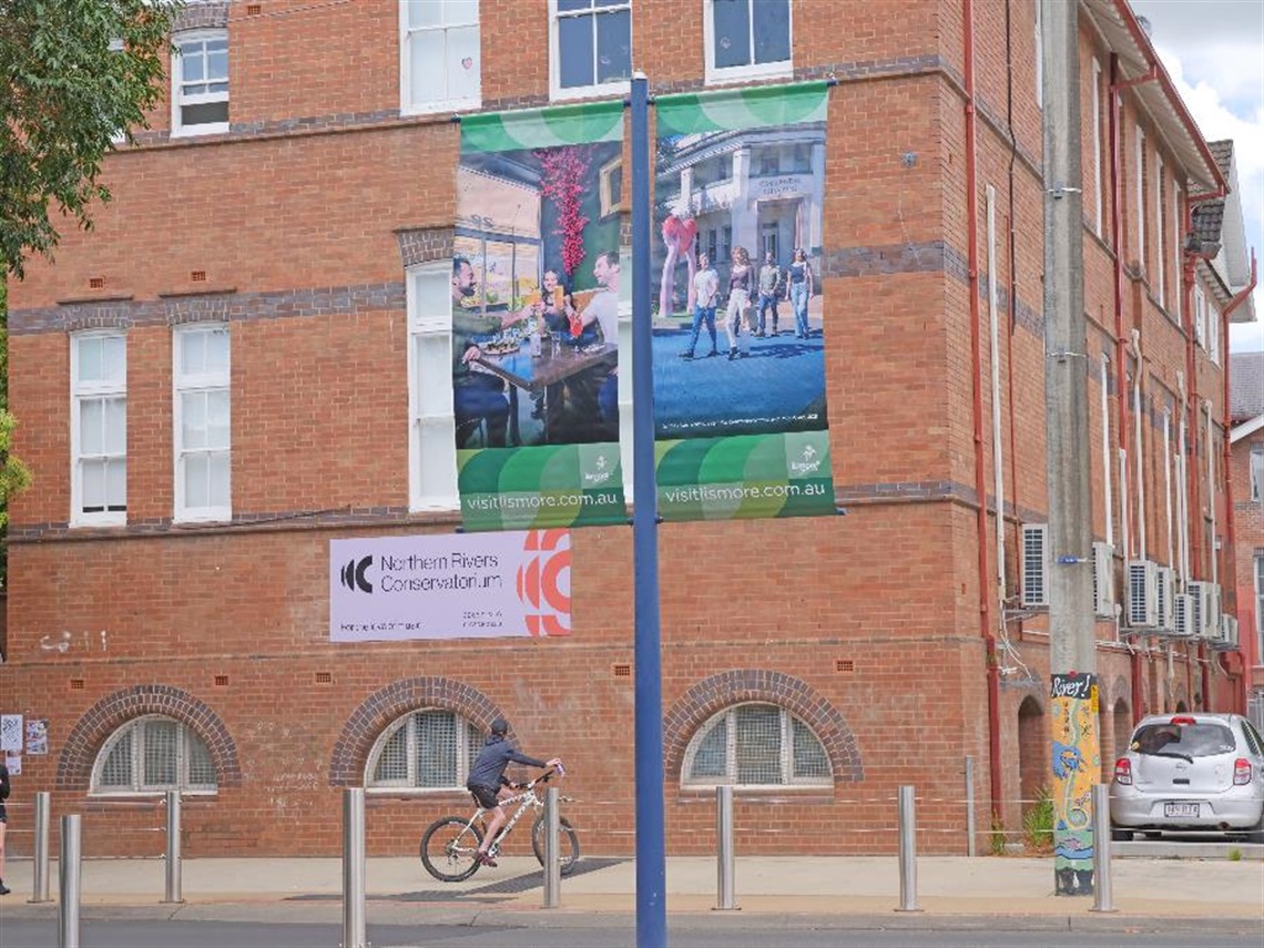 Spring season promotional banner on a pole