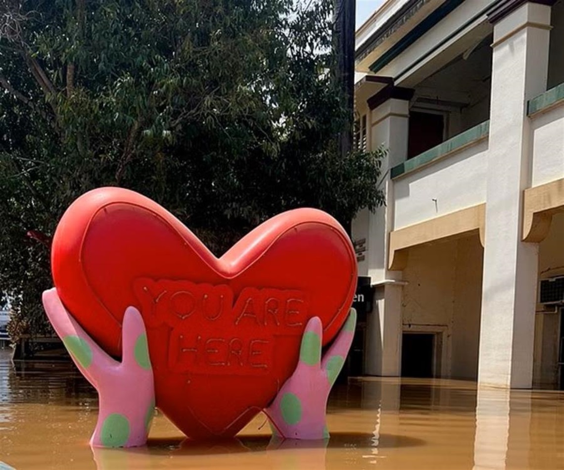 The You Are Here heart sculpture in downtown Lismore sitting in flood waters.