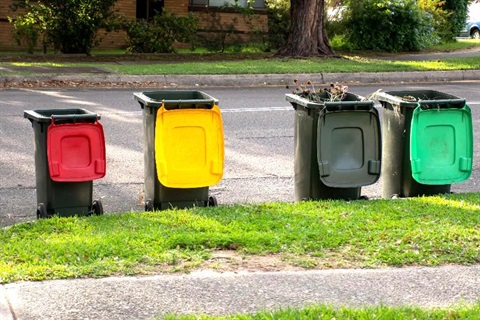 Bins that have been emptied sitting on the kerb.