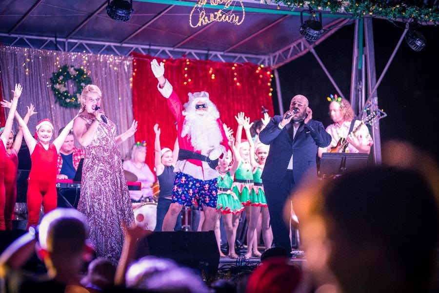 santa on stage at the carols